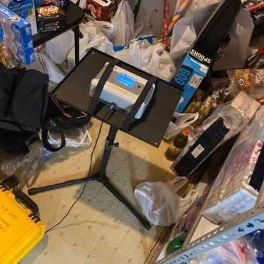 Radon testing setup by Green Earth Remediation in a home garage, featuring advanced detection equipment.
