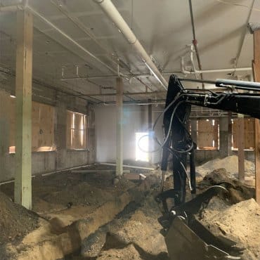 Excavation in progress for a vapor intrusion mitigation system by Green Earth Remediation.
