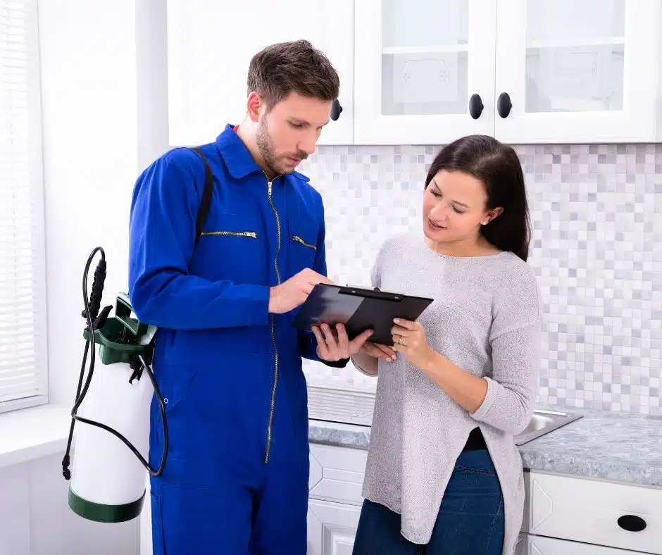 Homeowner reviewing estimate with pest control specialist