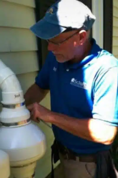 Bill Schultz, Founder of Green Earth Remediation installing a radon mitigation system.