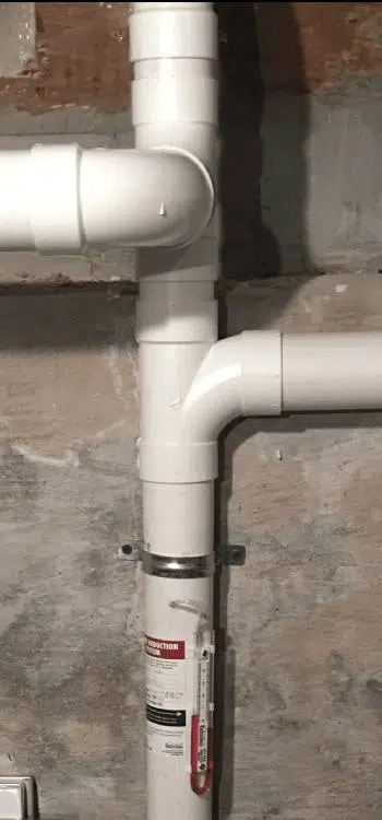 Radon mitigation pipe inside home.