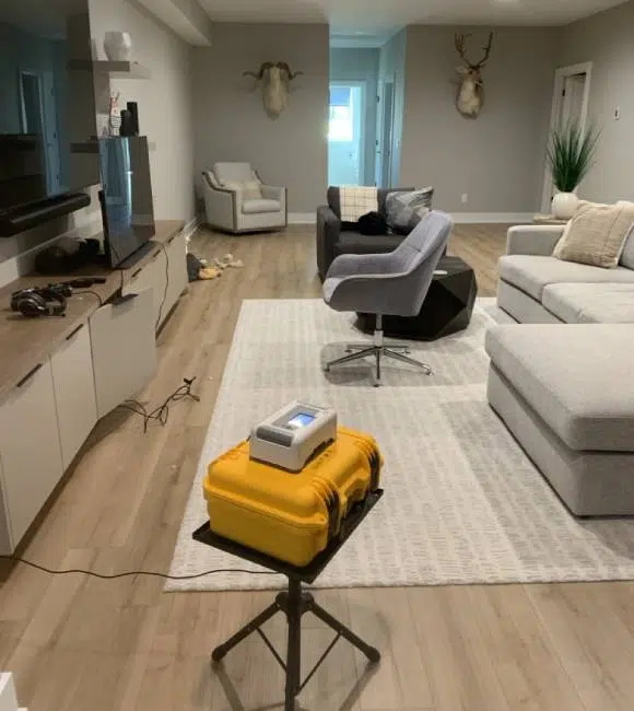 Residential radon testing equipment in living room.
